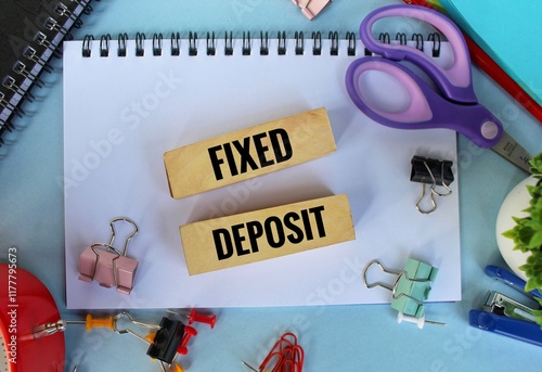 The word fixed income written on wooden blocks. Fixed deposit concept.