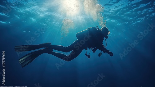 Wallpaper Mural Scuba diver silhouette exploring sunlit ocean depths. Torontodigital.ca