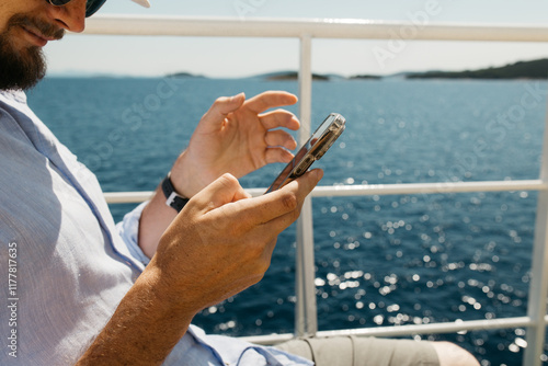 man holding a mobile phone photo