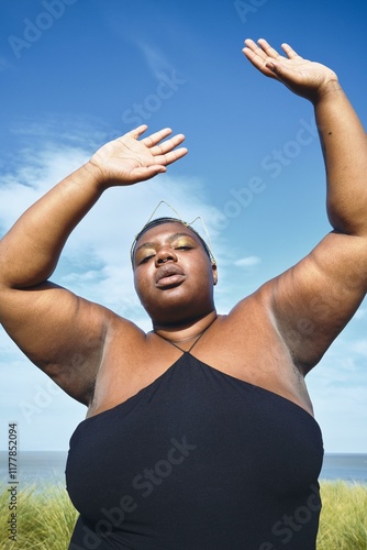 Joyful beach pose for body positivity photo