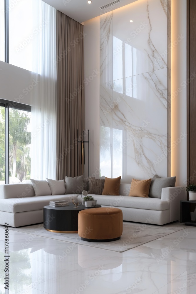 A large living room with a white wall and a white couch. The couch is covered in pillows and a coffee table is in the middle of the room. The room has a modern and elegant feel to it A large living room with a white wall and a white couch. The couch is covered in pillows and a coffee table is in the middle of the room. The room has a modern and elegant feel to it
