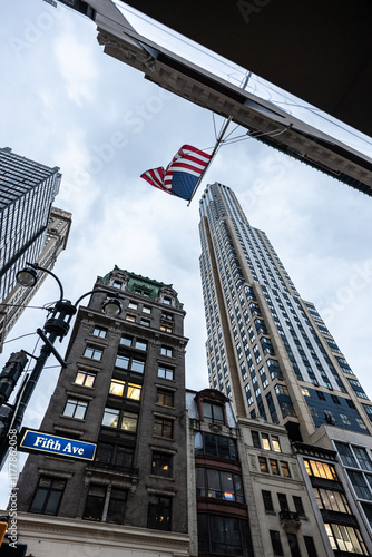 American flag waving over fifth avenue in manhattan, new york city