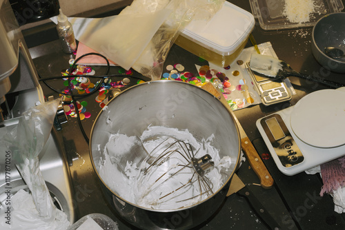 Mixing ingredients for a sweet dessert in a busy kitchen  photo