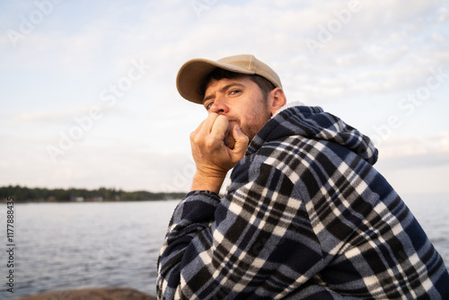 Thoughtful Man Sitting on Beach photo