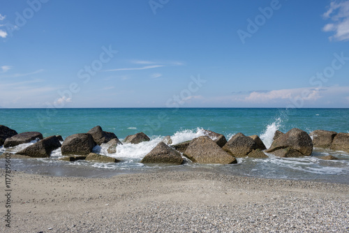 Sand beach with breakwaters, Spadafora, Sicily, Italy photo