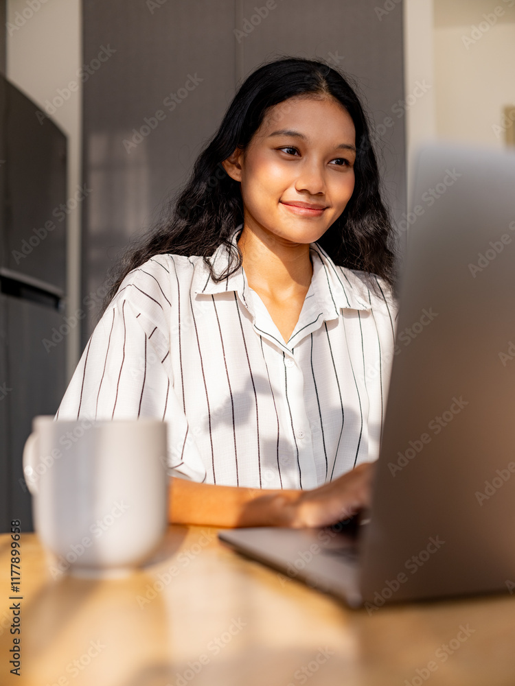Young Woman Focused on Remote Work at Home Desk Young Woman Focused on Remote Work at Home Desk