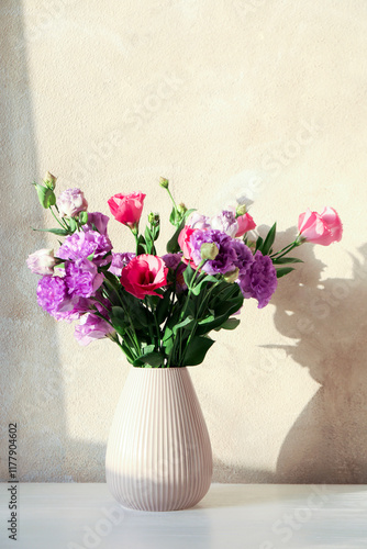 Wallpaper Mural Vase with beautiful eustoma flowers on white wooden table Torontodigital.ca