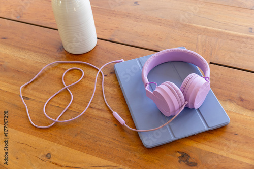 Tablet computer  headphones on table  photo