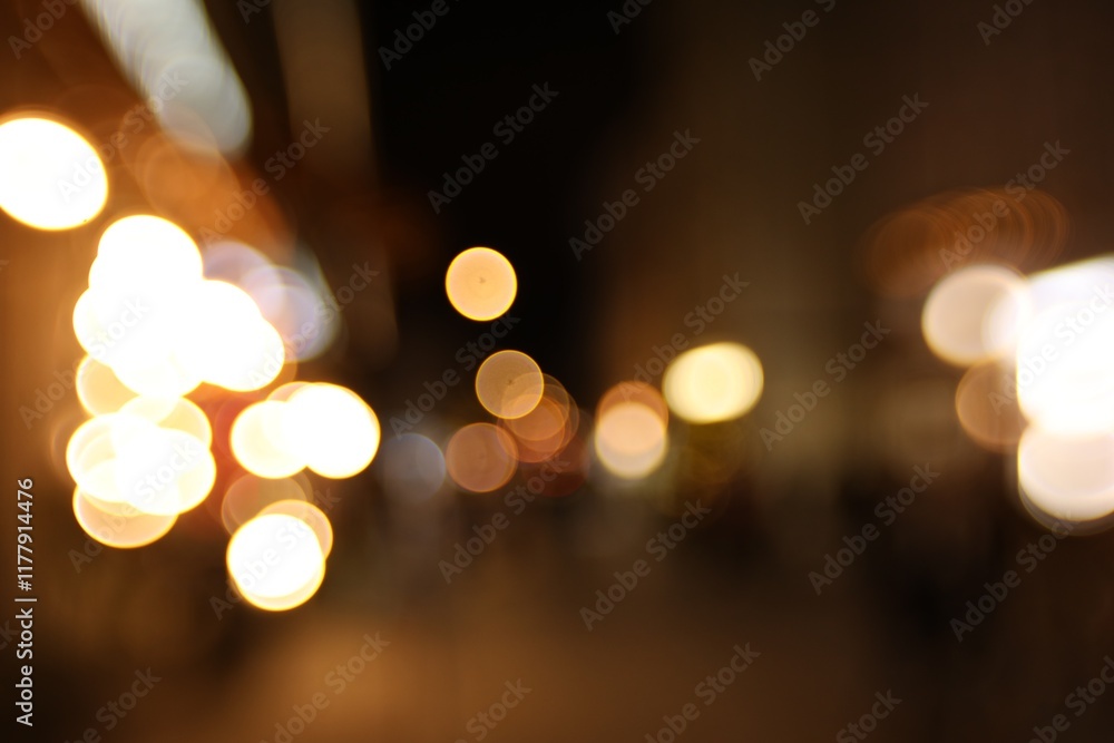 Fototapeta premium Blurred view of city street at night. Bokeh effect