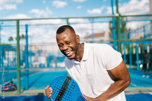 A paddle player laughs a lot photo