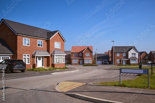 Modern residential street in a suburban neighbourhood on a sunny day photo