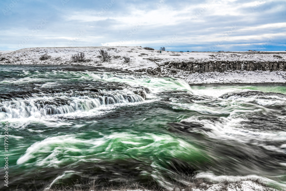 Fototapeta premium long exposure ice winter Iceland water running waterfall