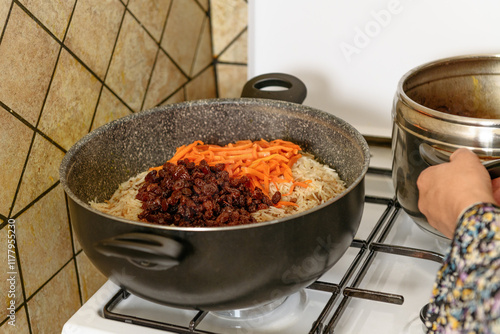 Traditional afghani pilaf Kabuli Pulao in the pot