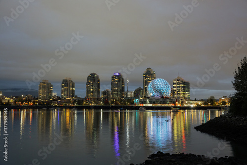 Beautiful Night Skyline of Vancouver with Reflections on Water photo