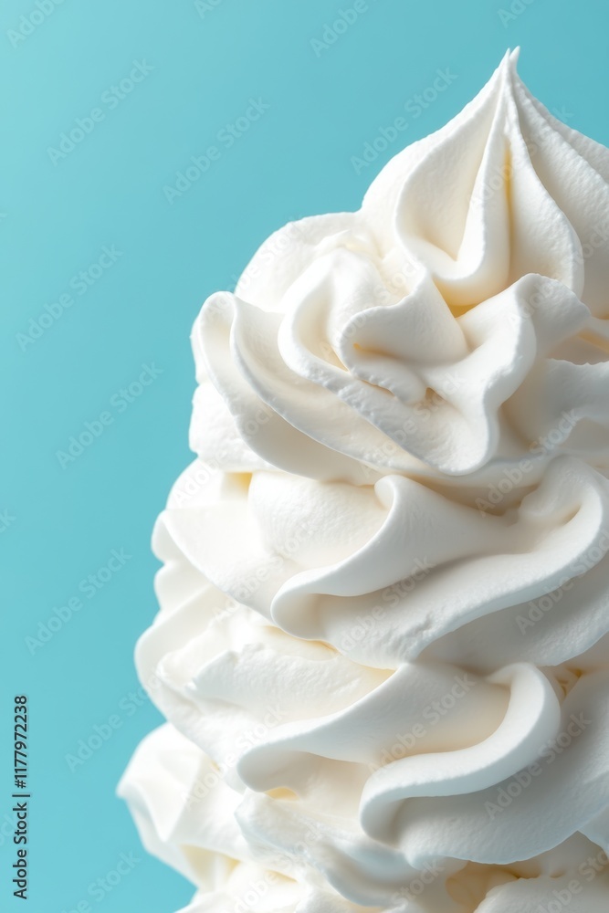 Whipped Cream Swirl on Pastel Blue Background, Close-Up Detail Whipped Cream Swirl on Pastel Blue Background, Close-Up Detail