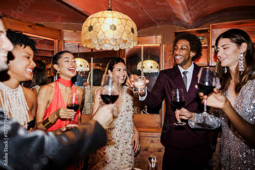 Friends toasting drinks at a New Year's party in a pub ugc photo