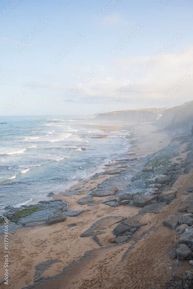 Misty Coastal View with Waves and Cliffs Along Ericeira Shore Misty Coastal View with Waves and Cliffs Along Ericeira Shore