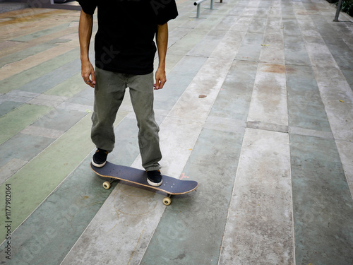 Skateboarder doing kickflip photo