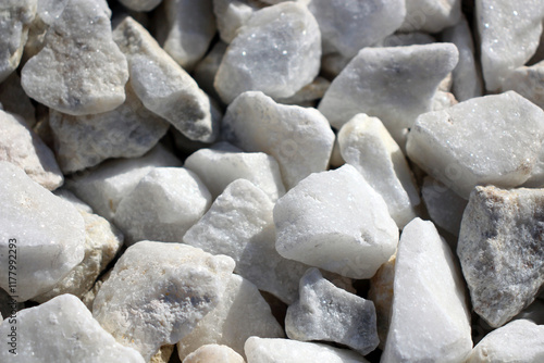 Close-up of white stones and pebbles in natural sunlight.