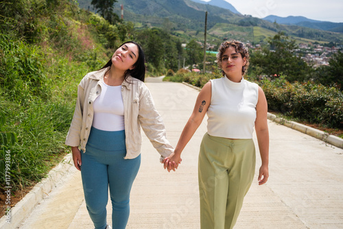 Lesbian womens holding hands while walking photo