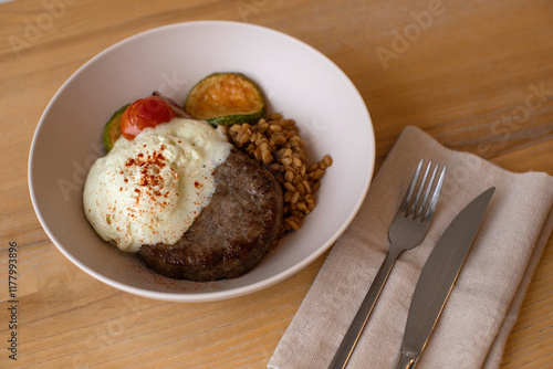 Meat patty with spelt and vegetables photo