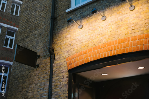 Lit Sign on Brick Wall photo