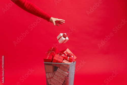 Christmas presents and gifts in trash can. Over consumption  photo