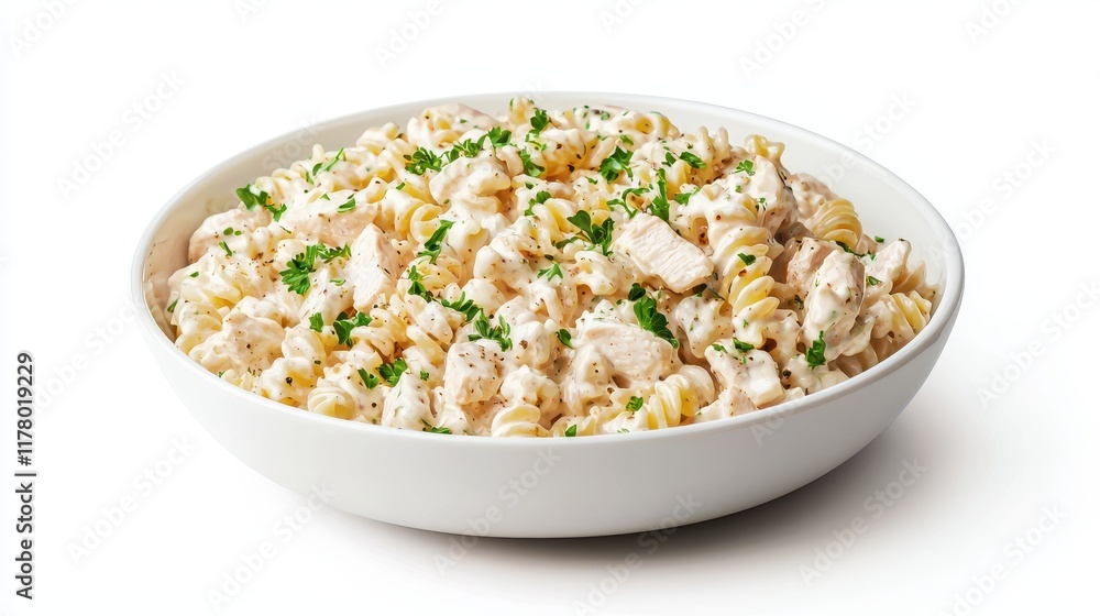 A bowl of creamy chicken alfredo pasta with a sprinkle of parsley on a white isolated background A bowl of creamy chicken alfredo pasta with a sprinkle of parsley on a white isolated background