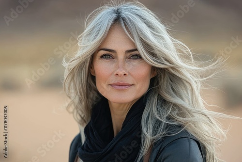 A mature woman with grey hair and a black scarf, possibly in a contemplative or reflective mood photo