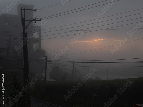 Sunset barely visible through heavy mist, Alishan, Taiwan.