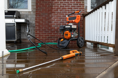 Pressure washer hose on porch of home 