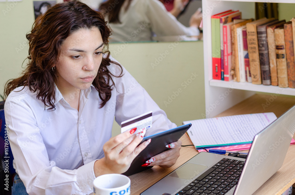 Young woman buying or payment with credit card for online shopping with a digital tablet Young woman buying or payment with credit card for online shopping with a digital tablet