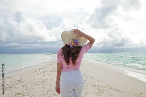  Woman Walking Along the Beach photo