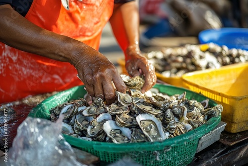 Captivating close up of hands shucking fresh oysters at a bustling seafood market stall photo