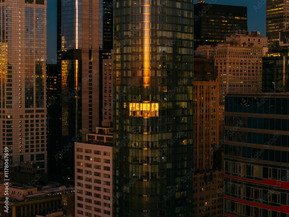 Glowing solo Window in Manhattan High-Rise at Night