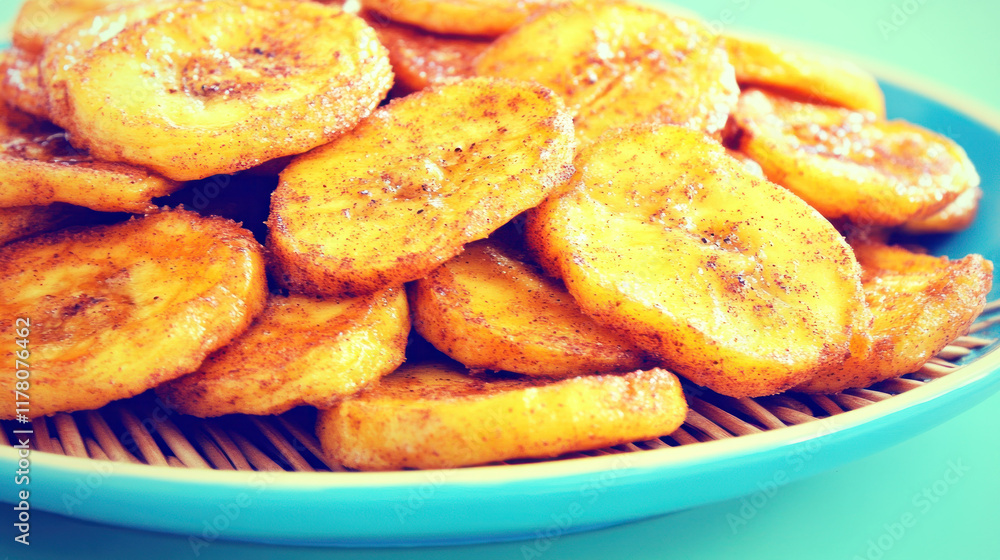 Fried banana slices on blue plate. Fried banana slices on blue plate.