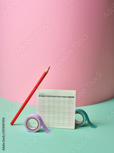 Minimalist Stationery Setup with Calendar and Colored Tape photo