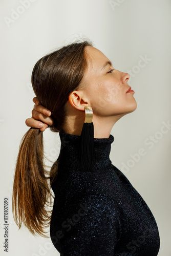 Woman styling her hair 