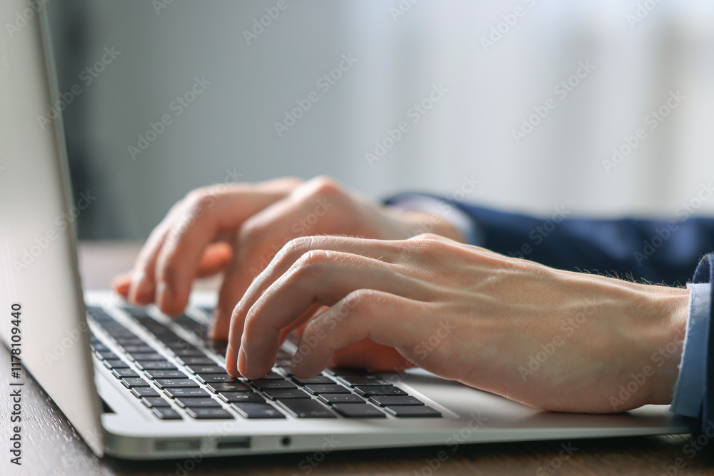 Businessman using laptop indoors, closeup. Modern technology Businessman using laptop indoors, closeup. Modern technology