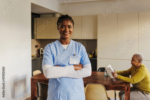 Portrait of female caregiver smiling at camera photo