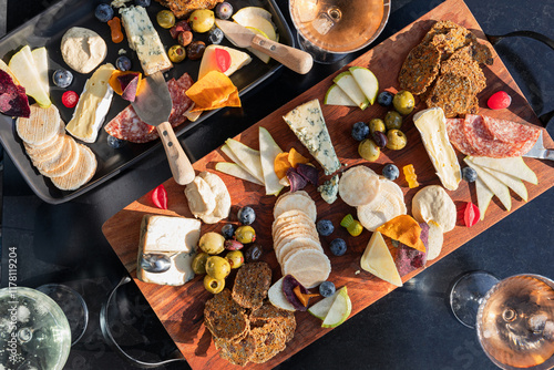 Cheese and charcuterie board with fruits and crackers photo