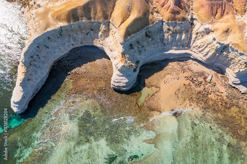 Eroded cliffs and rugged coastline photo