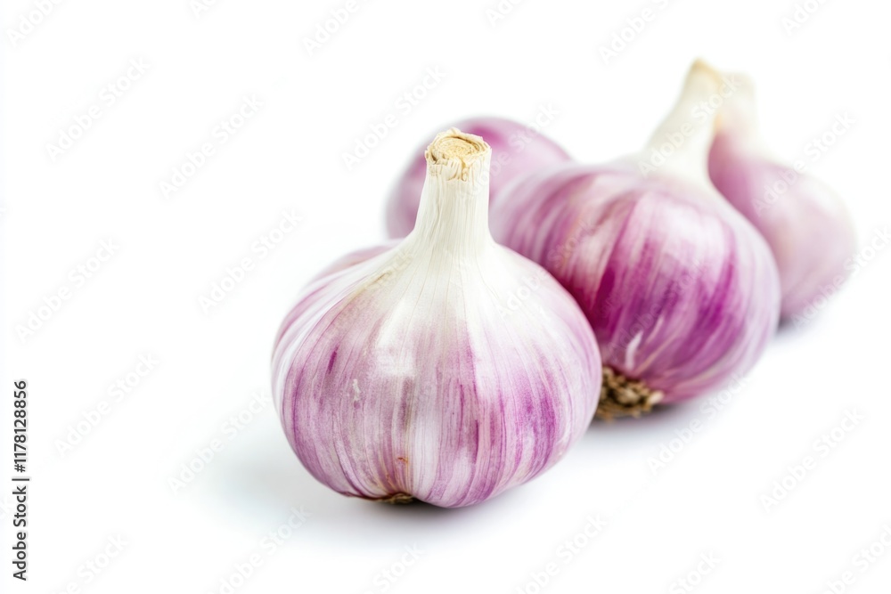 Obraz premium Close-up of three garlic bulbs on a white background