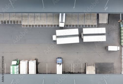 Aerial view of a logistics center with open sided truck trailers photo