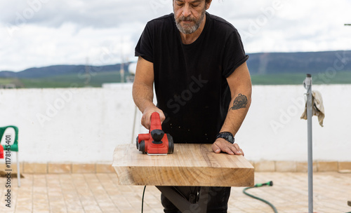 Man using powertool photo