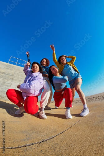 Group of diverse friends dancing together photo