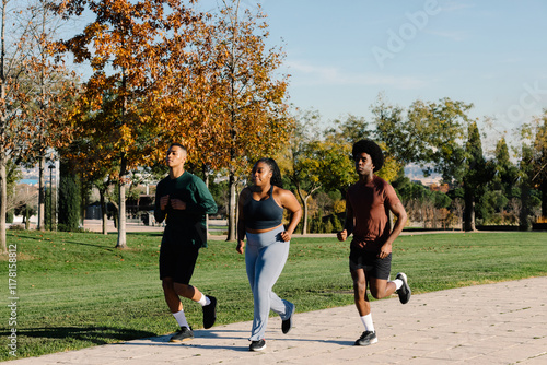 Afro-European friends training together during a morning exercise photo