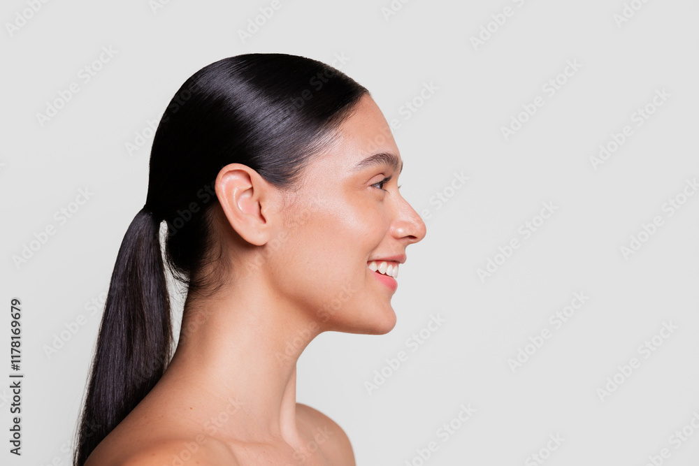 Profile of a Smiling Young Woman with Sleek Hair and Radiant Skin Profile of a Smiling Young Woman with Sleek Hair and Radiant Skin