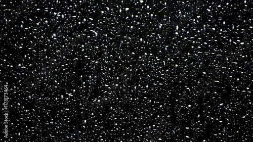 Rain drops png cover dark glass surface. Suitable for backgrounds, textures, weatherrelated themes, and concept designs for water and urban environments. photo