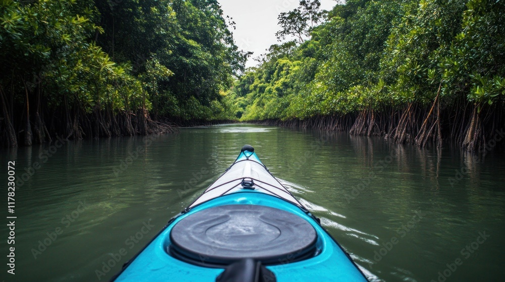 Fototapeta premium Kayaking through a serene mangrove forest waterway.